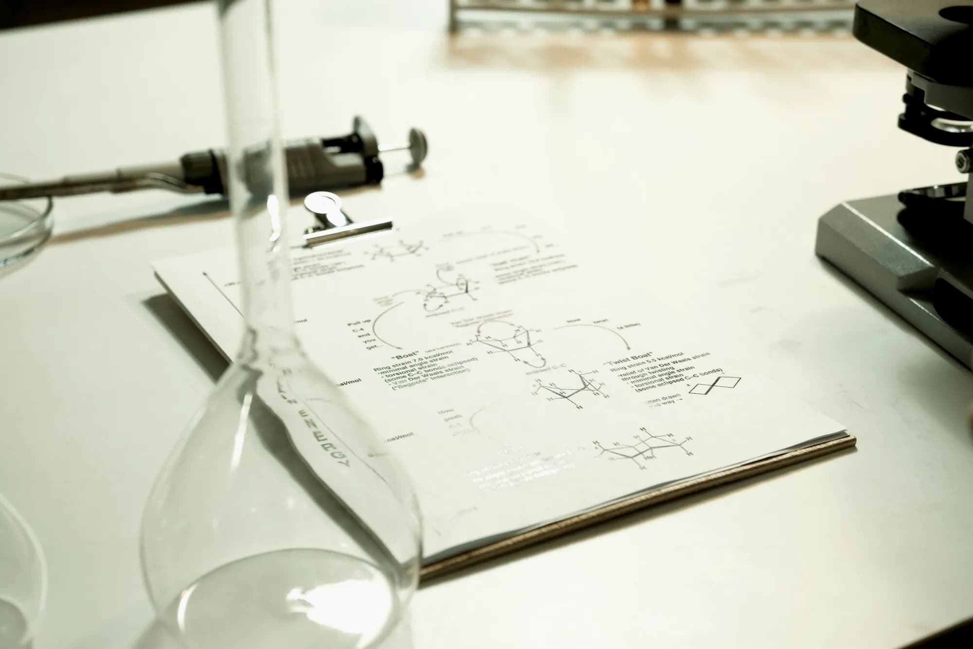 Technical documentation and analysis reports on a laboratory desk